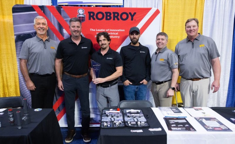 Robroy associates posing with NTI associates as Robroy accepts award for platinum partnership with electrical training ALLIANCE 